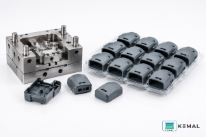 Injection mold with production batch of molded plastic parts